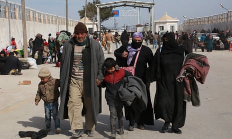 Syrian refugees waiting to cross the border into Turkey